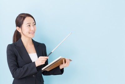 portrait of asian businesswoman on blue background