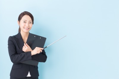 portrait of asian businesswoman on blue background